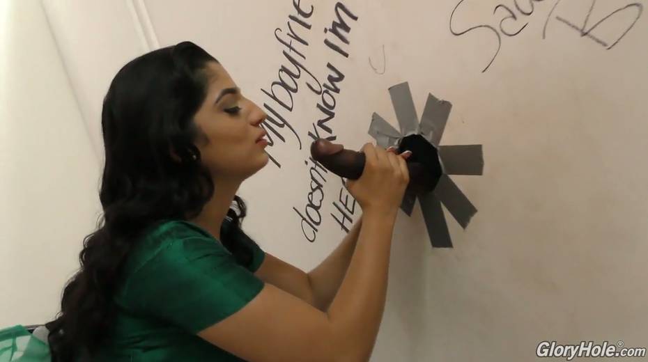 Hot Pakistani chick Nadia Ali sucks big dick in the glory hole room - 7. pic