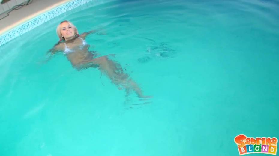 Young blonde Sabrina Blond is swimming in the pool and making love with her boyfriend - 3. pic