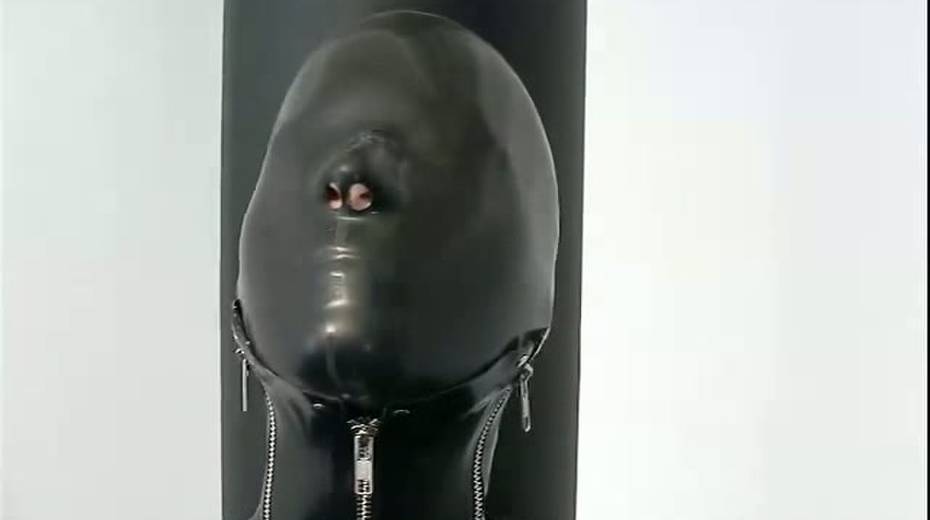 Busty porn model in rubber costume is tied up on the floor - 2. pic