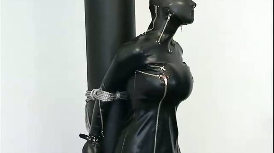 Busty porn model in rubber costume is tied up on the floor - 3. pic