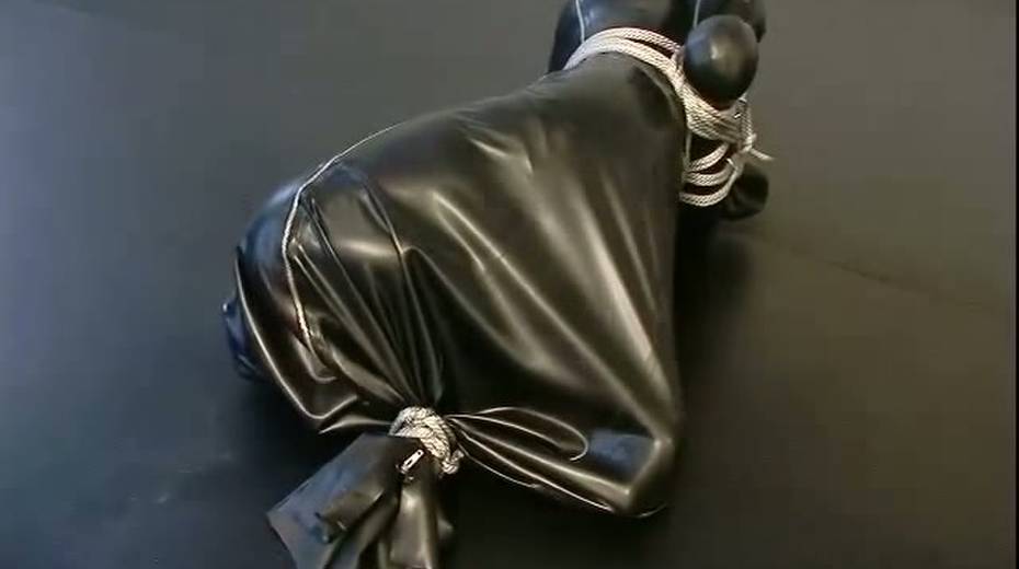 Busty porn model in rubber costume is tied up on the floor - 6. pic