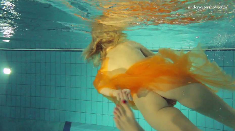Pretty hot red head Nastya is stripping under the water - 3. pic