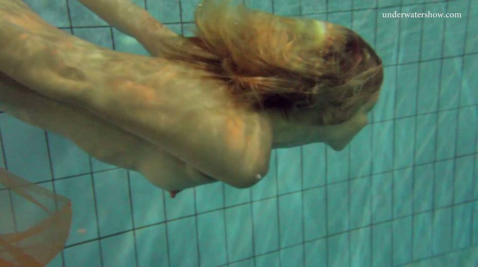 Pretty hot red head Nastya is stripping under the water - 9. pic
