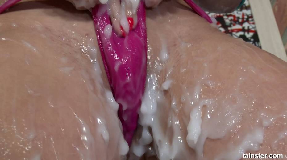 Clothed bitch goes wild in the glory hole room and smears sperm all over her body - 18. pic