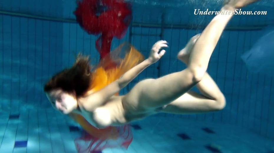 Breath taking underwater show featuring sexy babe in dress - 2. pic