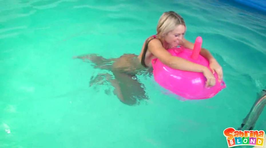 Cute blondie Sabrina Blond is playing with inflatable dildo chair in the pool - 13. pic
