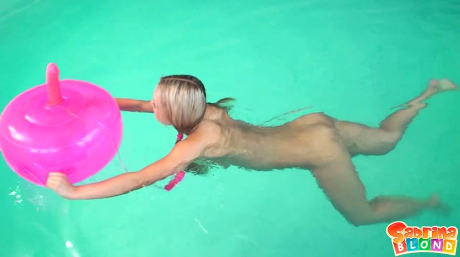 Cute blondie Sabrina Blond is playing with inflatable dildo chair in the pool - 16. pic