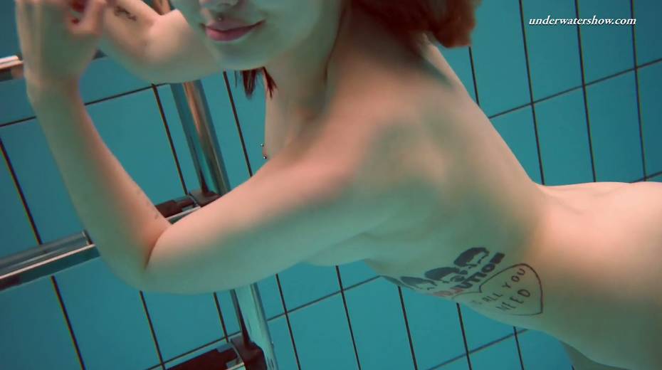 Attractive babe Dashka shows striptease under the water - 24. pic