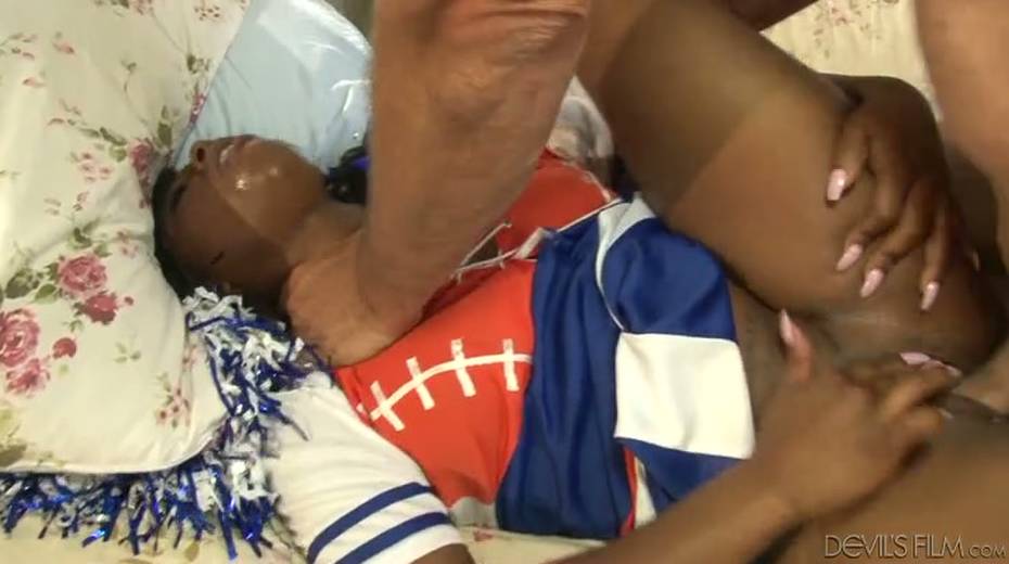 Chocolate cheerleader gets mercilessly fucked from behind - 2. pic