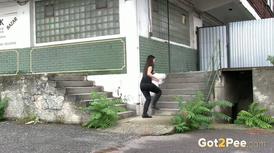 Slim black haired bitch loves pissing outdoors - 3. pic