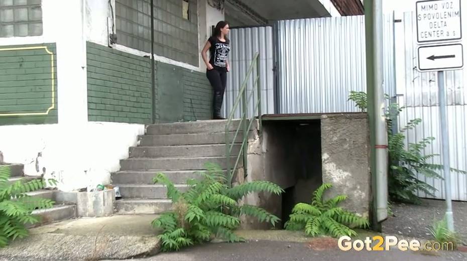 Slim black haired bitch loves pissing outdoors - 4. pic