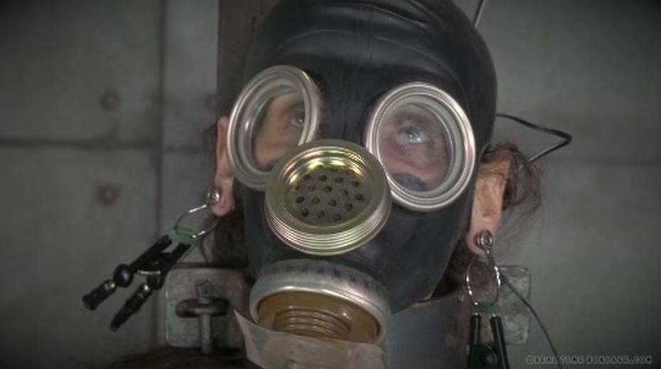Horny mistress ties her slave to a chair and puts a gas mask on her - 10. pic