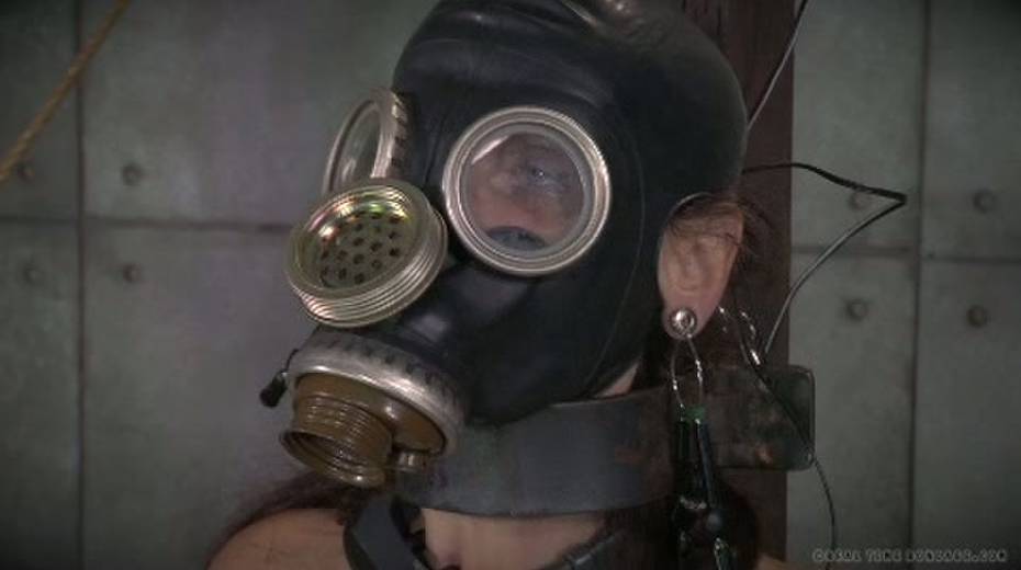 Horny mistress ties her slave to a chair and puts a gas mask on her - 15. pic