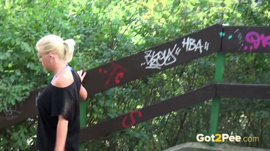 Whorish blond haired girlie pisses outdoors with pleasure - 14. pic