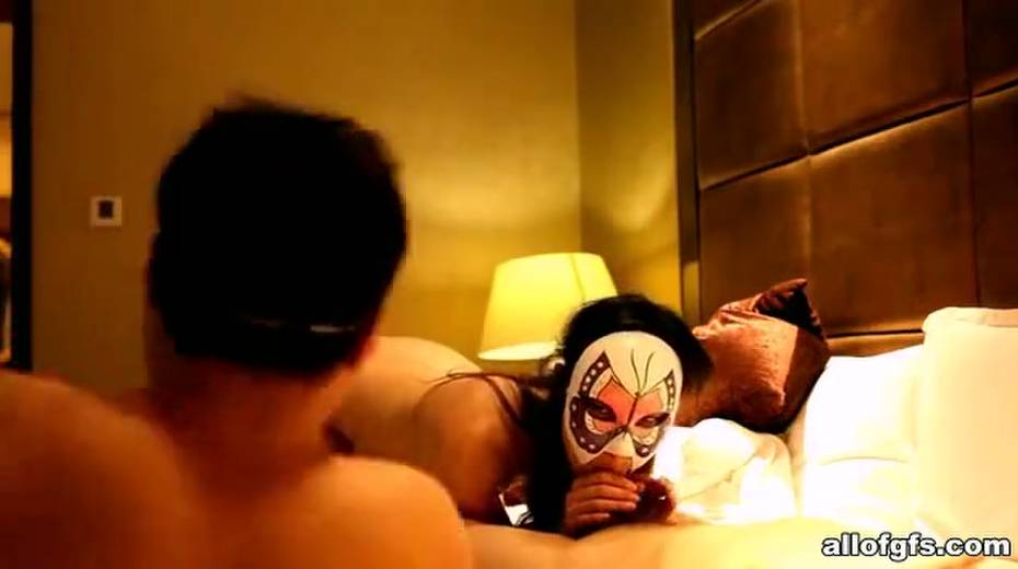 Skinny Asian chick puts on her mask and takes on two hard cocks at once - 11. pic