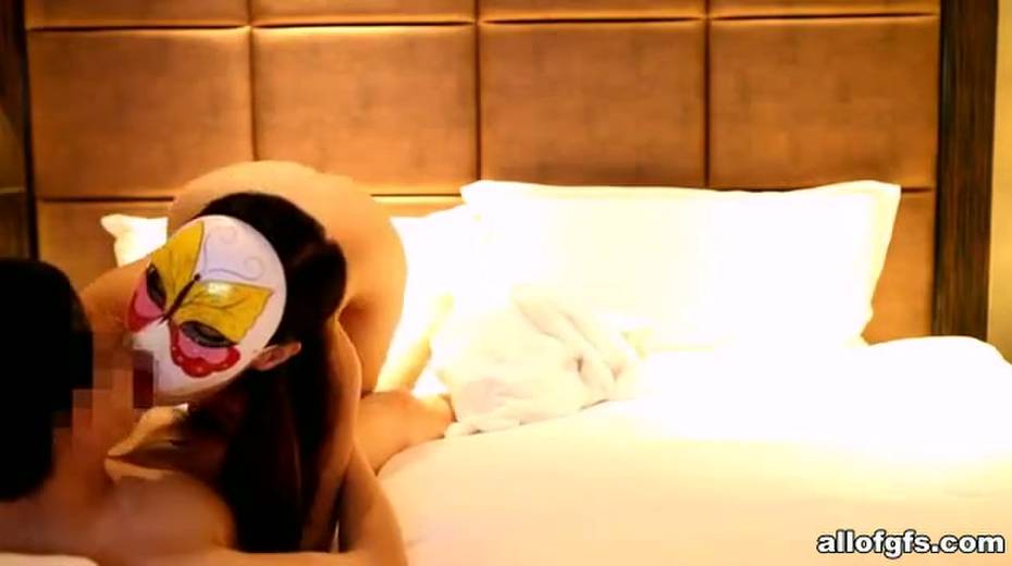 Skinny Asian chick puts on her mask and takes on two hard cocks at once - 14. pic