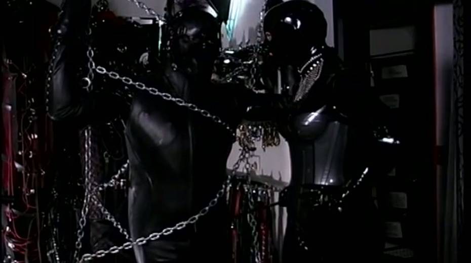 Latex mistress restrains and tortures a male slave in rubber costume - 4. pic