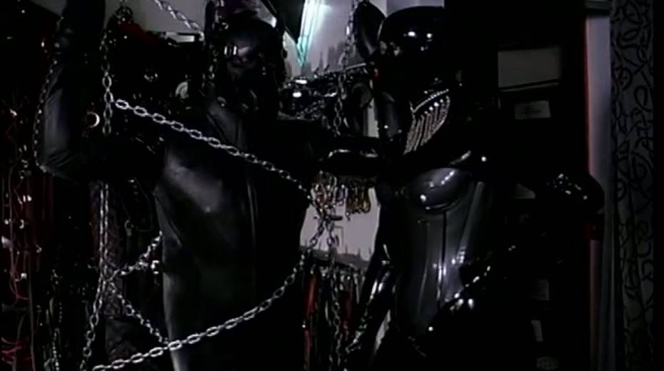 Latex mistress restrains and tortures a male slave in rubber costume - 9. pic