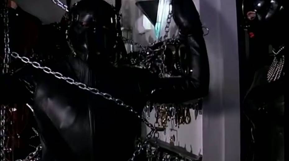 Latex mistress restrains and tortures a male slave in rubber costume - 10. pic