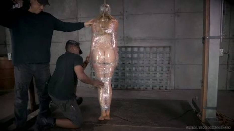 Chick in plastic wrap is punished with big black sex toy - 2. pic