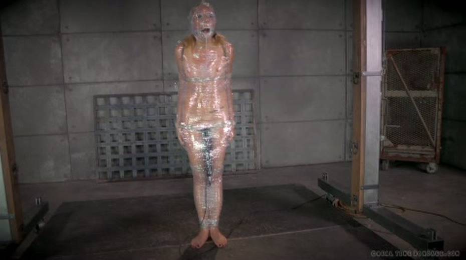 Chick in plastic wrap is punished with big black sex toy - 15. pic
