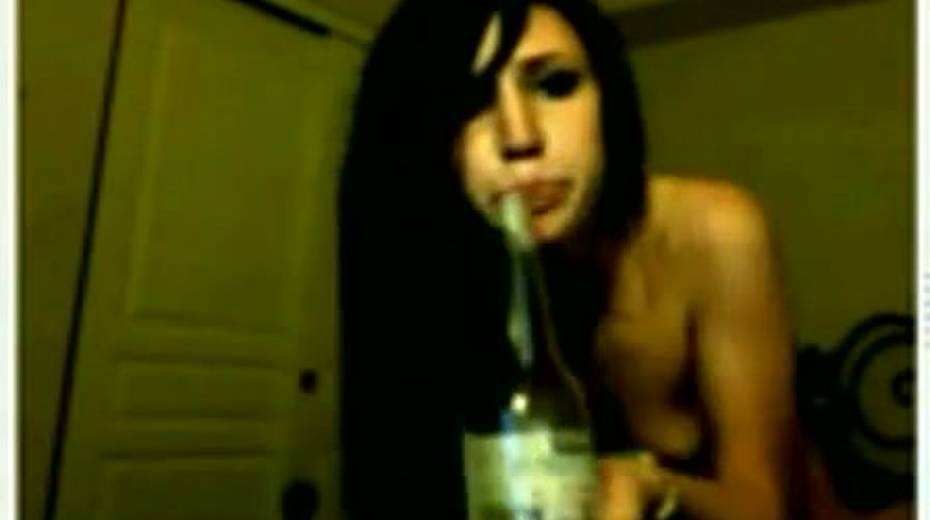 Slutty and horny bitch poking her twat with a bottle glass - 9. pic