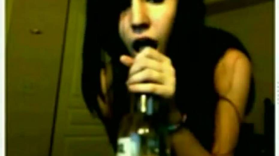 Slutty and horny bitch poking her twat with a bottle glass - 12. pic