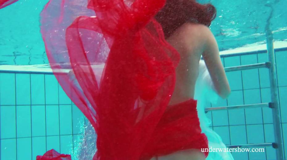 Two pretty hot babes are swimming and stripping under the water - 2. pic