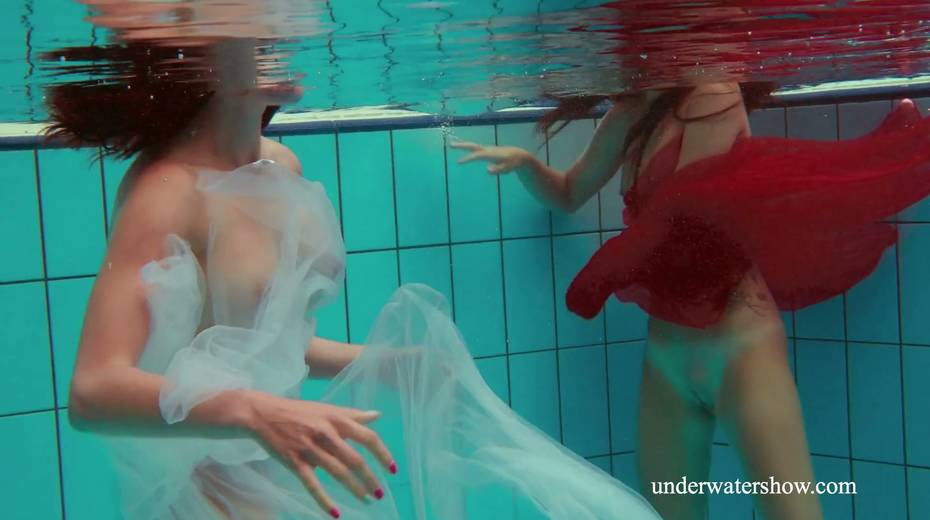 Two pretty hot babes are swimming and stripping under the water - 6. pic