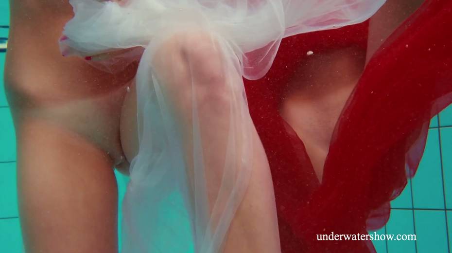 Two pretty hot babes are swimming and stripping under the water - 7. pic