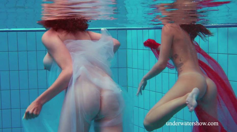 Two pretty hot babes are swimming and stripping under the water - 8. pic