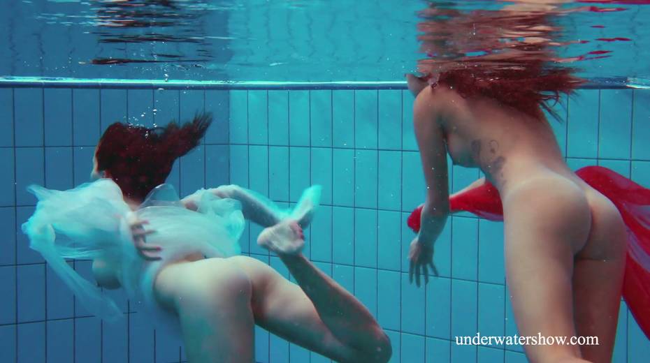 Two pretty hot babes are swimming and stripping under the water - 9. pic