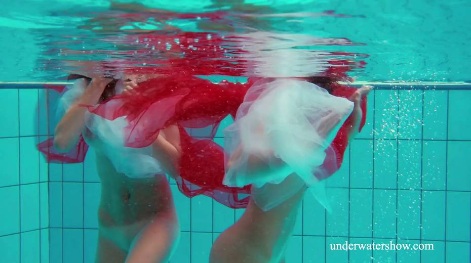 Two pretty hot babes are swimming and stripping under the water - 24. pic