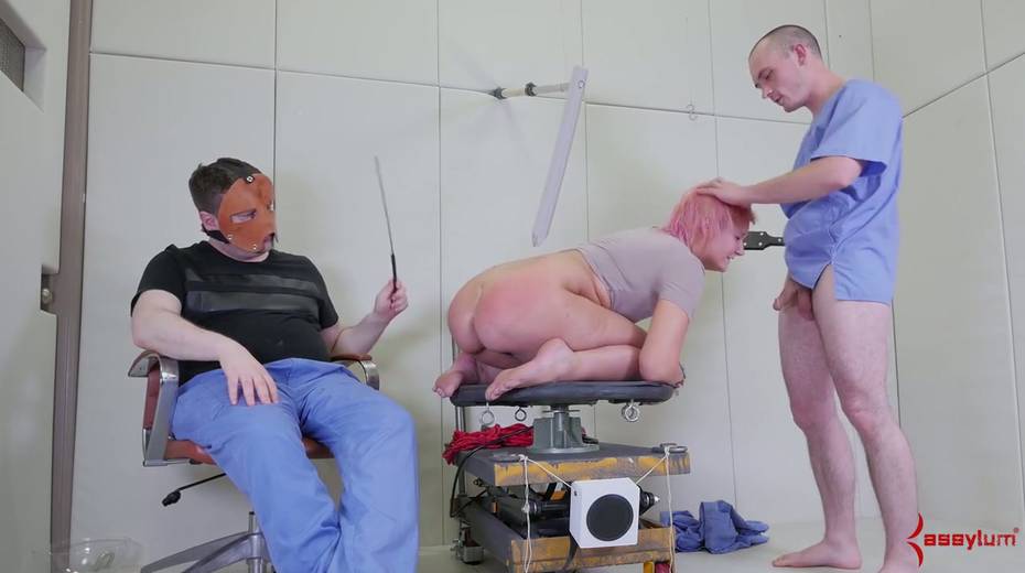 Slutty blonde is fucked in her mouth and anus by two kinky dudes in masks - 18. pic