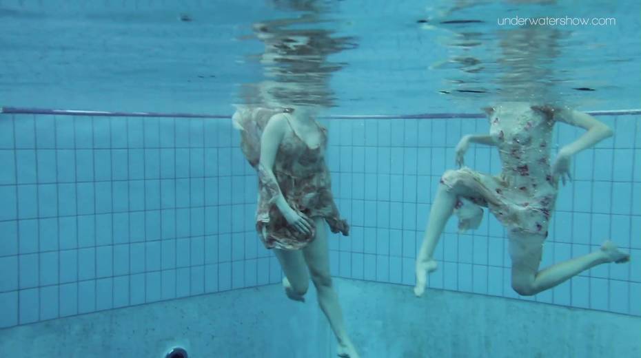 Two yummy swimming babes is stripping under the water - 3. pic