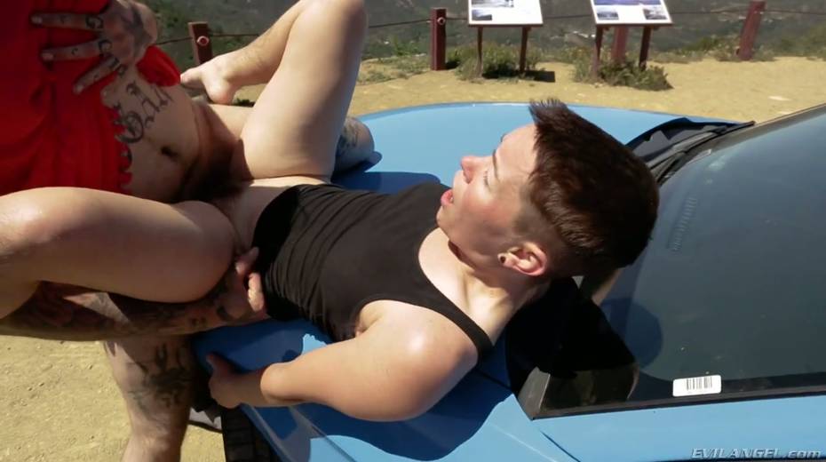 Short haired dyke Jiz Lee is fucked hard by tattooed crossdresser right on the car hood - 16. pic