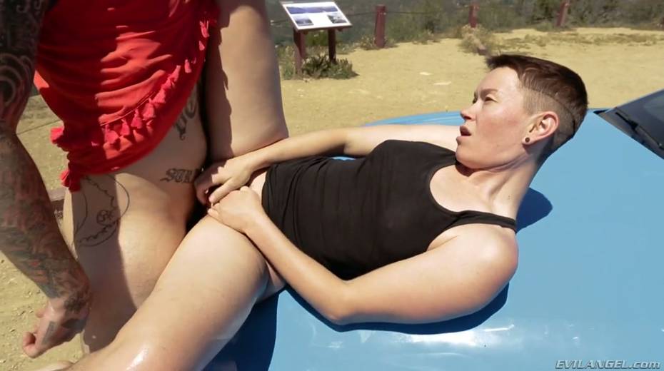 Short haired dyke Jiz Lee is fucked hard by tattooed crossdresser right on the car hood - 19. pic