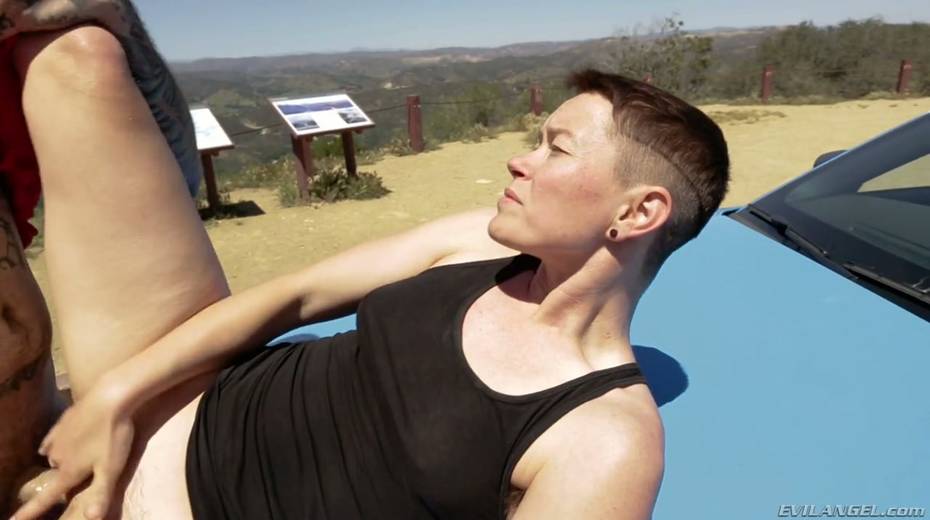 Short haired dyke Jiz Lee is fucked hard by tattooed crossdresser right on the car hood - 20. pic