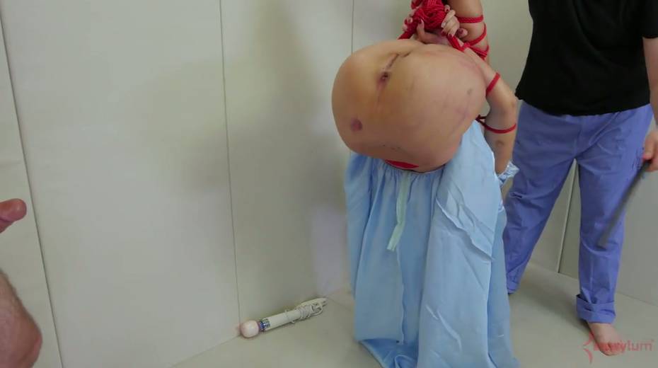 Two perverted guys spank and fuck anal hole of tied up and suspended porn model - 6. pic
