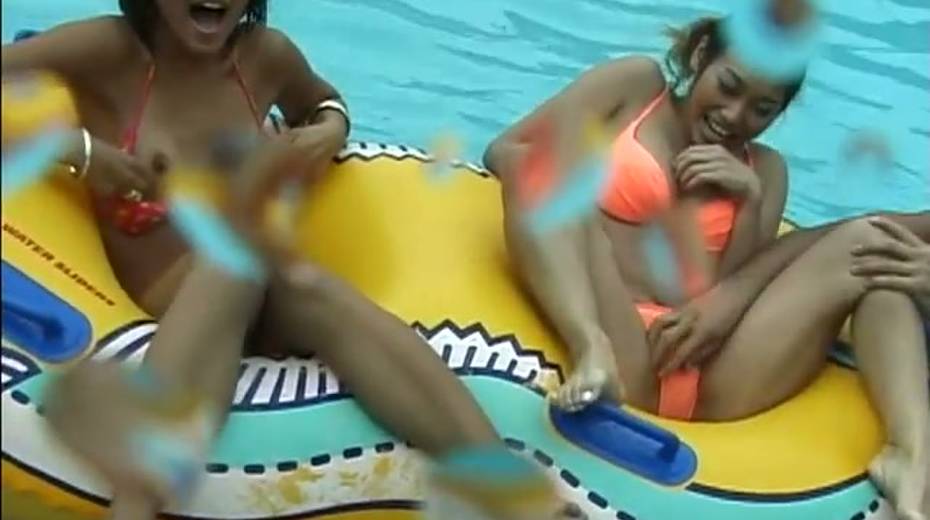 Frisky Japanese girls takes bikinis off right in a pool - 2. pic
