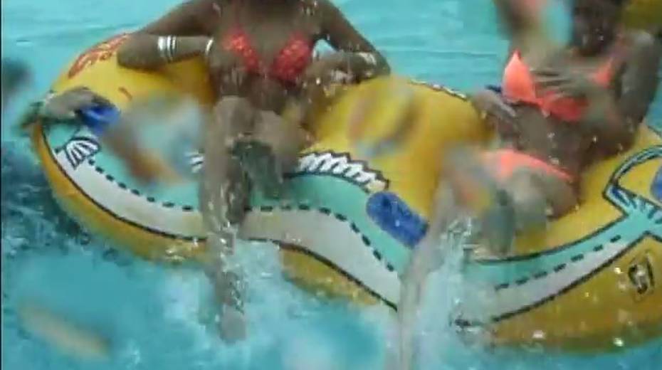 Frisky Japanese girls takes bikinis off right in a pool - 3. pic