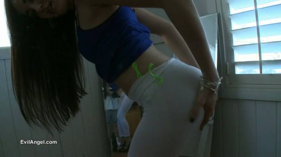 Kinky brunette girlie poses in her white tight pants to show off her bum - 5. pic
