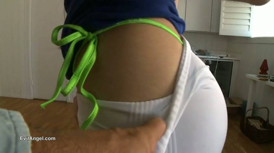 Kinky brunette girlie poses in her white tight pants to show off her bum - 12. pic